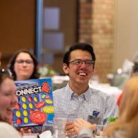 person showing connect 4 game
